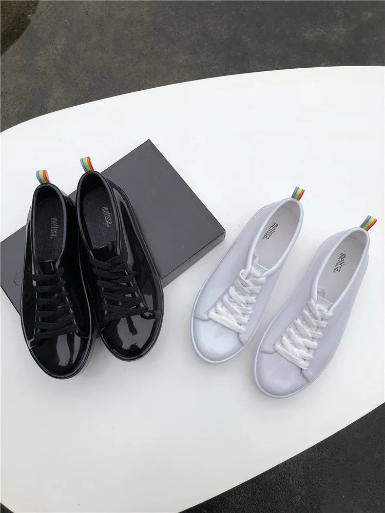 Premium lace-up sneakers for women with stylish flat design in black color