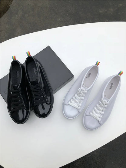 Premium lace-up sneakers for women with stylish flat design in black color