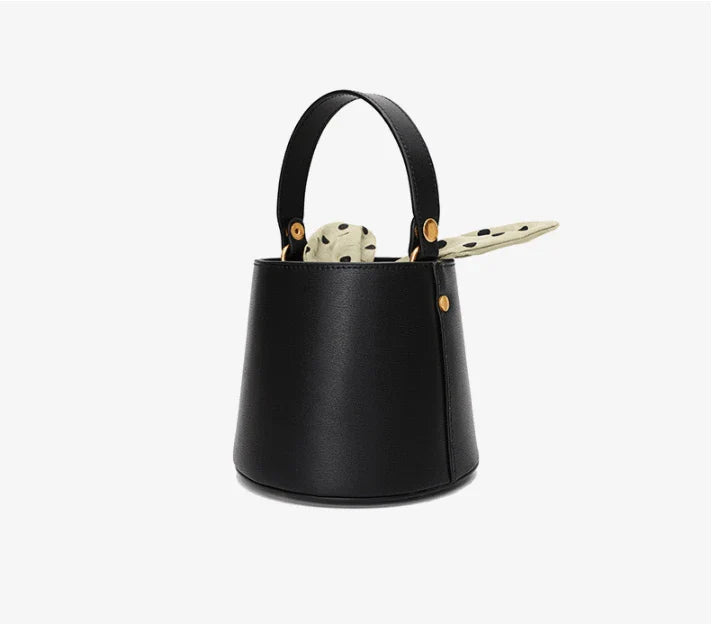 Premium leather bucket bag tote with bow-type closure, exquisite golden hardware, and versatile design