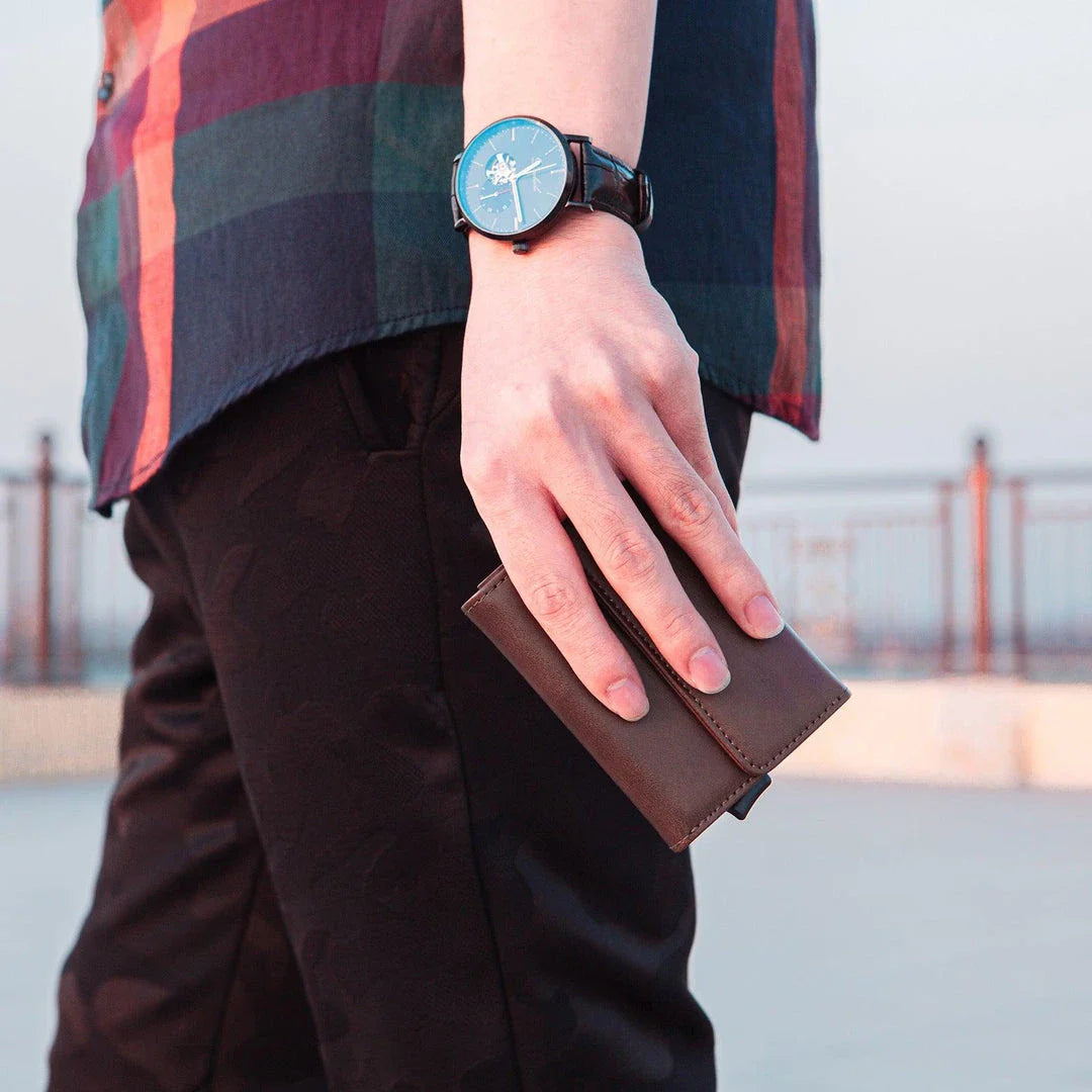 Stylish men's tri-fold wallet made of premium PU leather with magnetic buckle closure and multiple compartments for organization