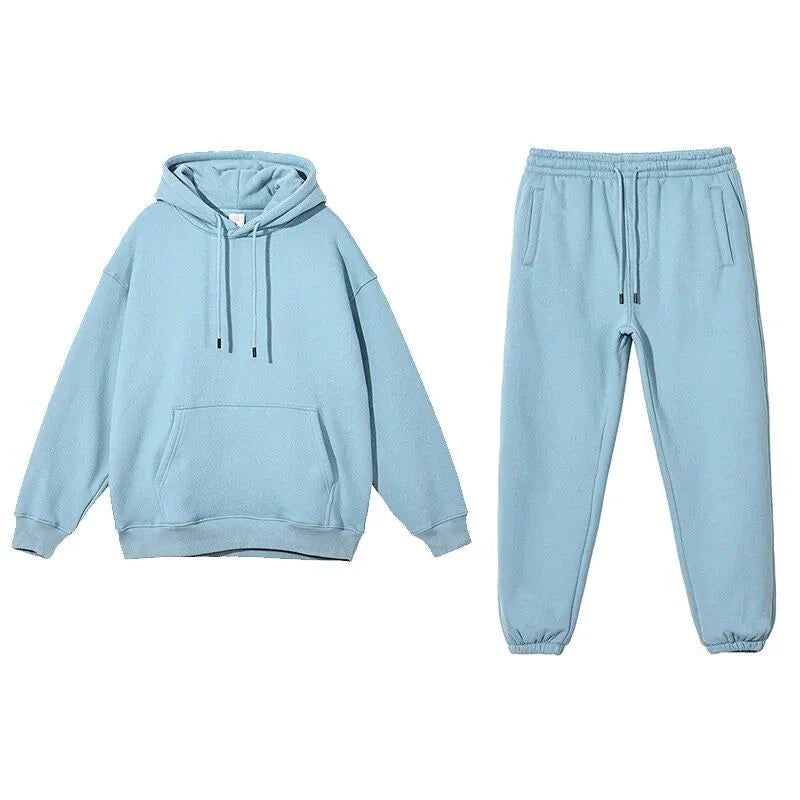 Cozy Fleece Hoodie and Sweatpants Set in Light Pink, featuring a relaxed fit and hooded design for maximum comfort and style.