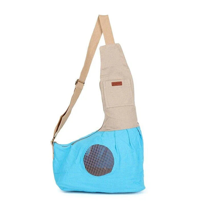Breathable canvas crossbody carrier for pets with adjustable strap and roomy interior