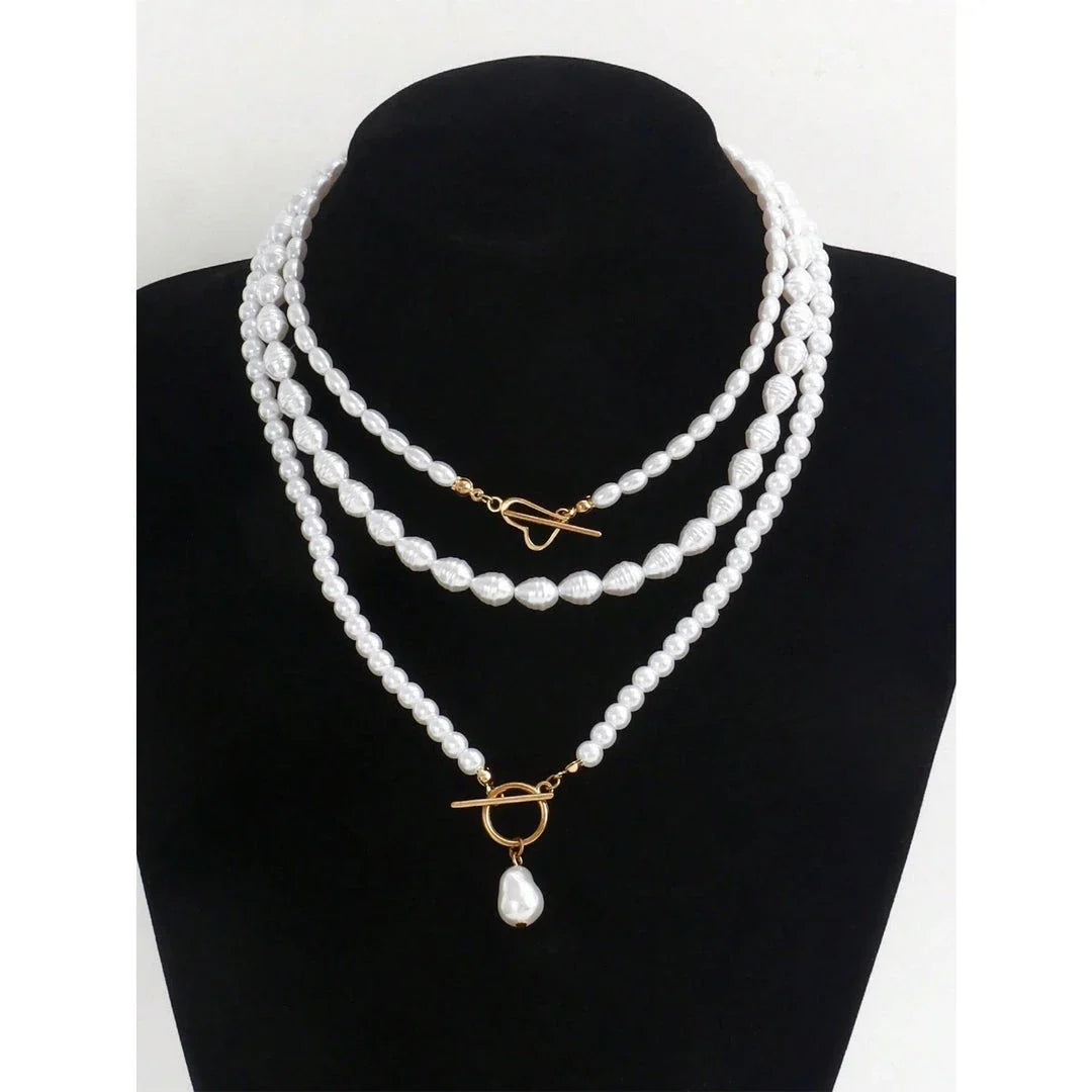 Elegant imitation pearl heart pendant necklace with lustrous bead chain and secure OT buckle closure