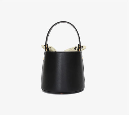Premium leather bucket bag tote with bow-type closure, exquisite golden hardware, and versatile design