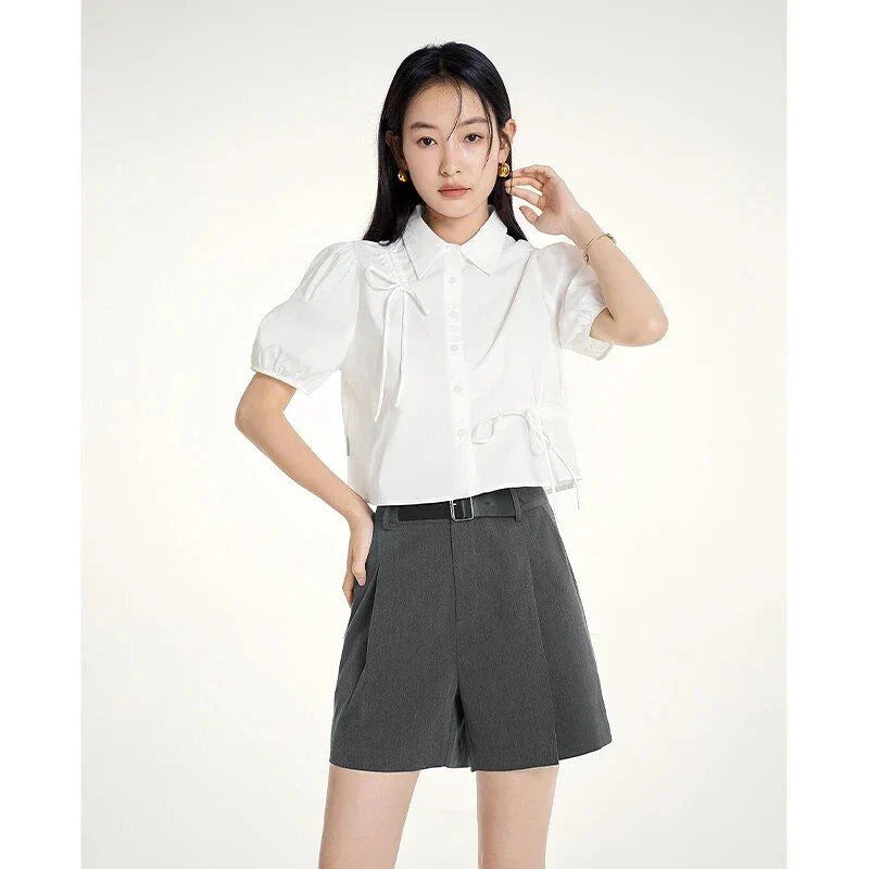 Elegant summer harem shorts for women with high-waist, loose fit, and subtle pleating detail