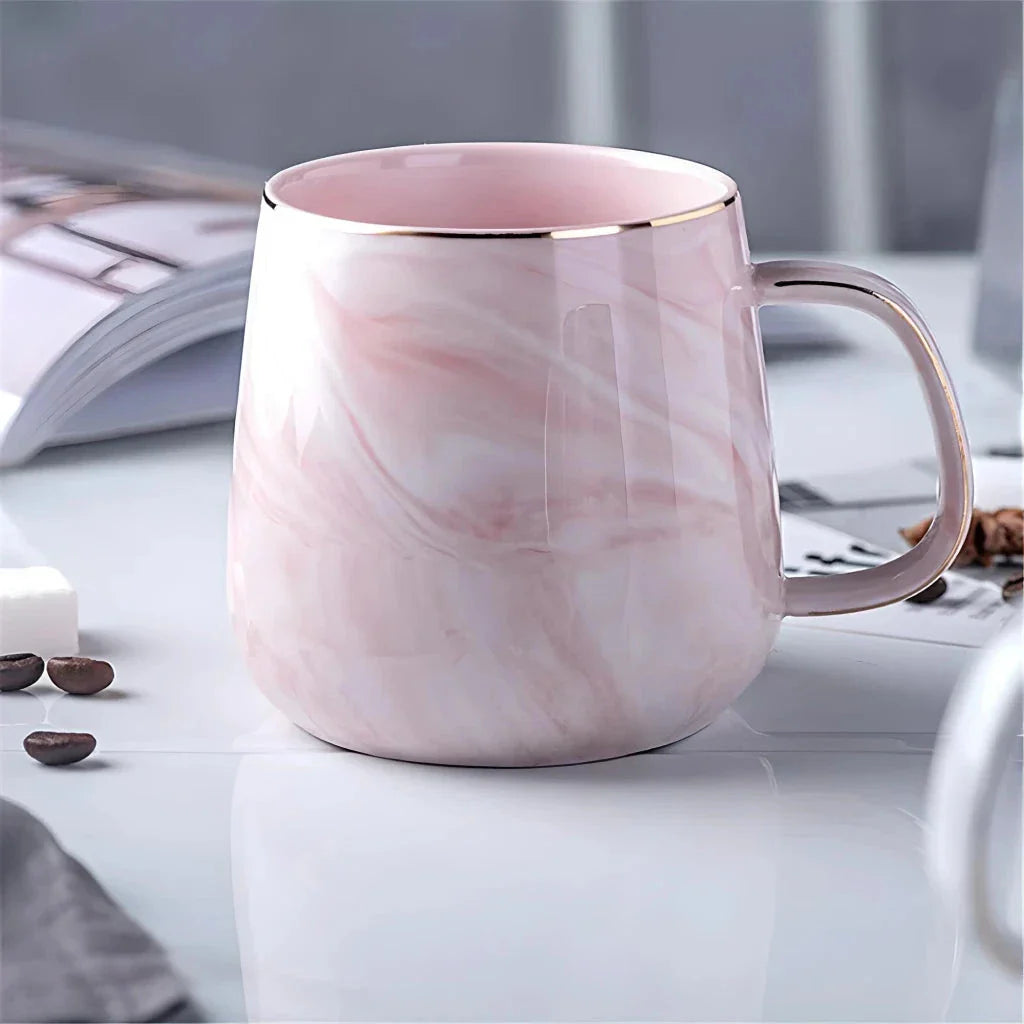 Elegant marble pattern ceramic mug with a gold rim, perfect for coffee, tea, and other hot and cold beverages