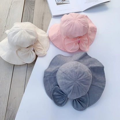 Adorable princess-inspired baby bucket hat with soft cotton material and wide brim for sun protection
