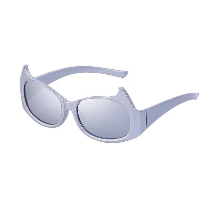 Stylish cat-eye sunglasses with oversized frames, semi-rimless design, and punk-inspired detailing for a timeless, glamorous look