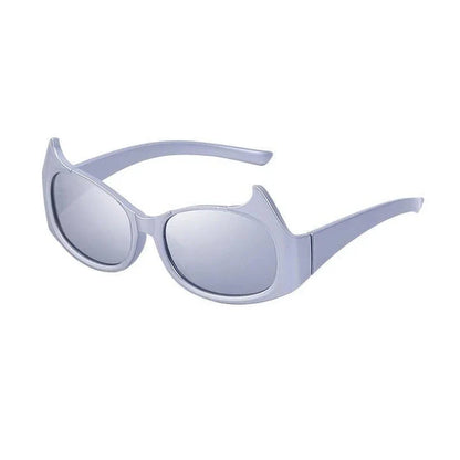 Stylish cat-eye sunglasses with oversized frames, semi-rimless design, and punk-inspired detailing for a timeless, glamorous look