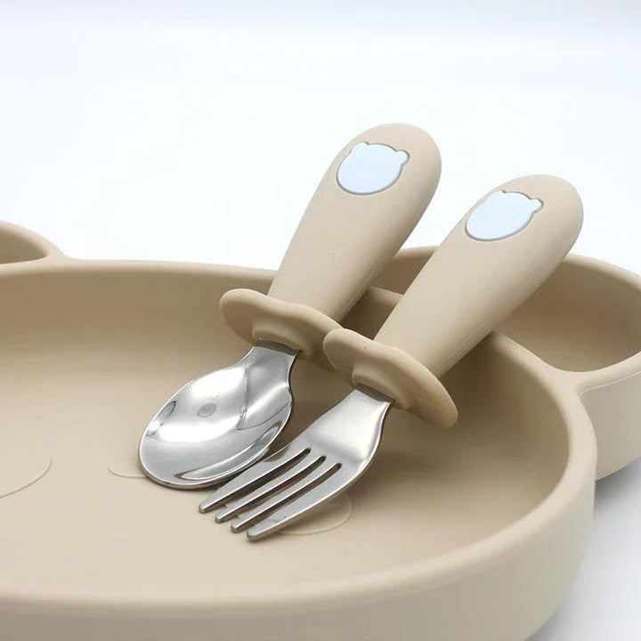 Cartoon Stainless Steel Kids' Cutlery Set with spoon and fork in playful designs, perfect for toddler and child mealtime