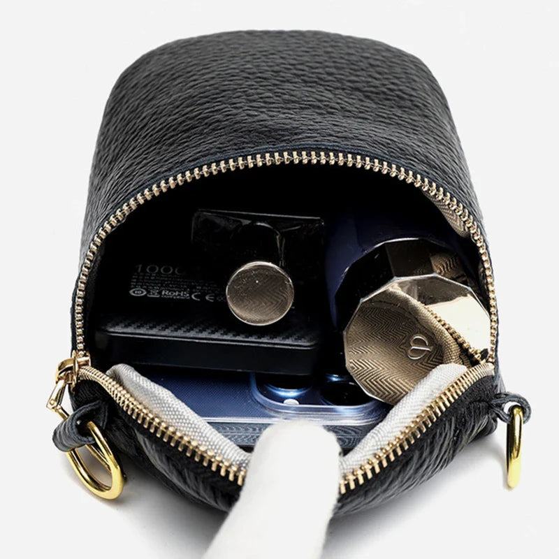 Premium leather crossbody bag with adjustable strap, multiple pockets, and sleek Korean-inspired style