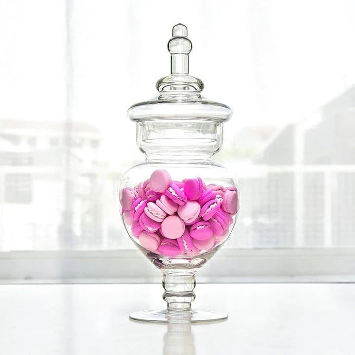 A transparent glass candy jar with an airtight lid, suitable for weddings, parties, and home decor