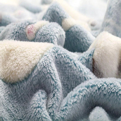 Cozy oversized fleece blanket in light blue and pink colors, suitable for both human and pet use