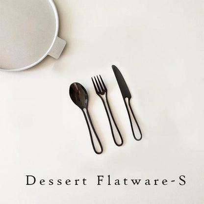 Sleek and modern 304 stainless steel cutlery set with a black finish, including knife, fork, and spoon for dinner and dessert.
