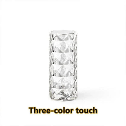 Elegant diamond-inspired crystal lamp with touch-sensitive dimming controls, providing adjustable ambient lighting for bedrooms and living spaces.