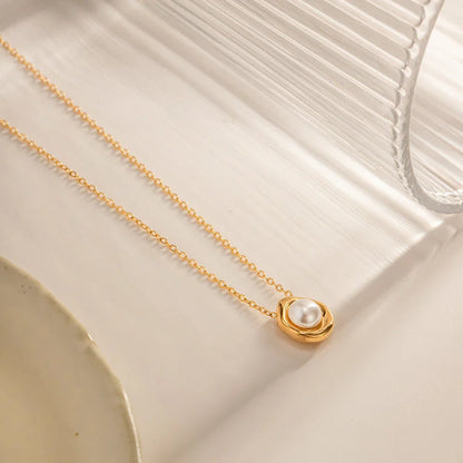 Elegant stainless steel pearl pendant necklace with a geometric design, perfect for women's fashion and everyday style.