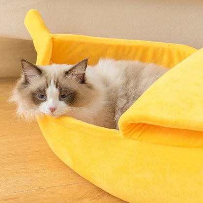 Cozy banana-shaped pet bed in various sizes and colors, providing plush comfort and support for cats and dogs