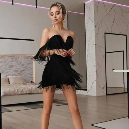 Elegant tassel-embellished bodycon mini dress in black, red, and white colors for glamorous occasions
