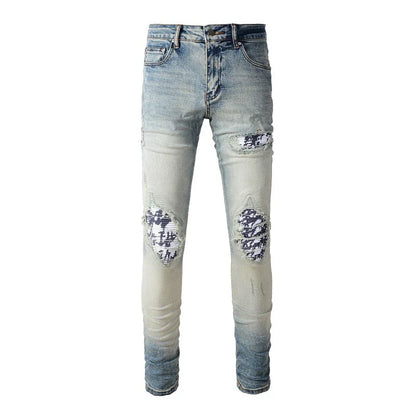 American High Street fashionable men's ripped black and white patch jeans in a light blue denim color