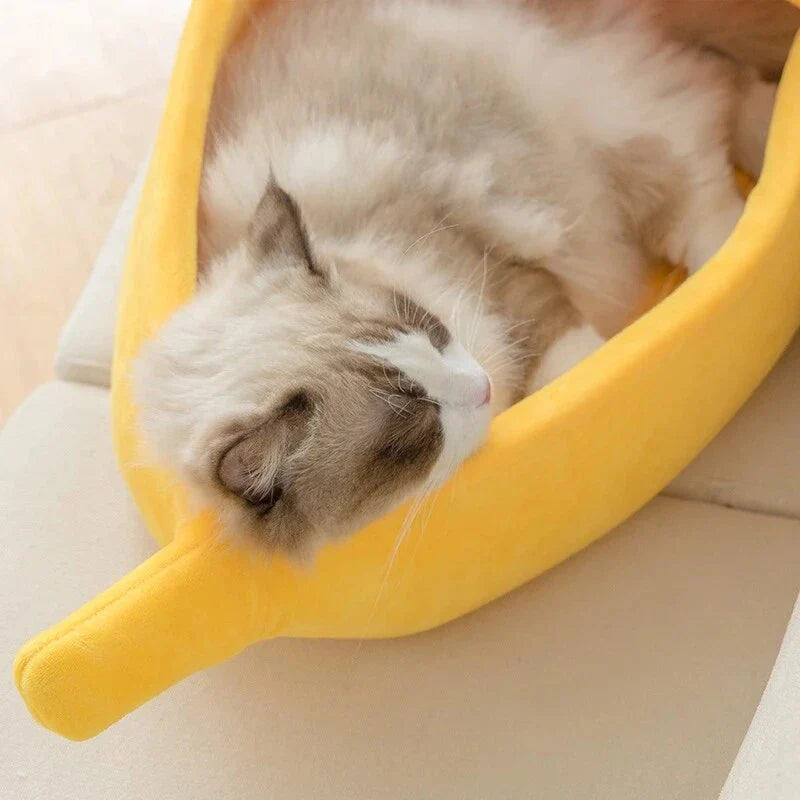 Cozy banana-shaped pet bed in various sizes and colors, providing plush comfort and support for cats and dogs
