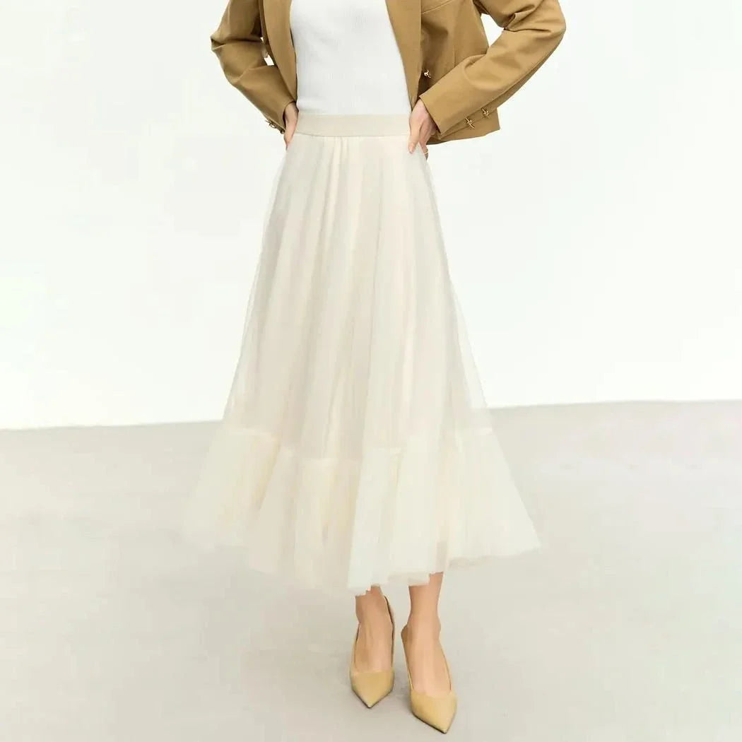 Elegant gauze A-line skirt in beige and white colors, featuring a graceful ankle-length design and unique patchwork detailing for a sophisticated look.
