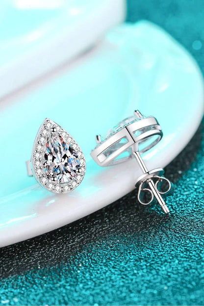 Captivating 925 sterling silver moissanite teardrop stud earrings with a polished rhodium-plated finish and zircon accent stones