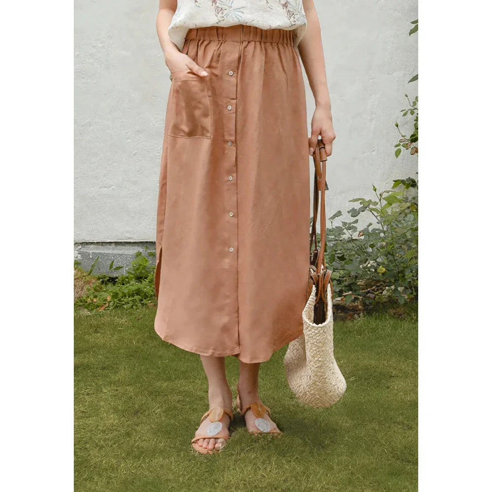 Elegant cotton linen maxi skirt with high waist, button-up front, and side split for a flowing, comfortable look
