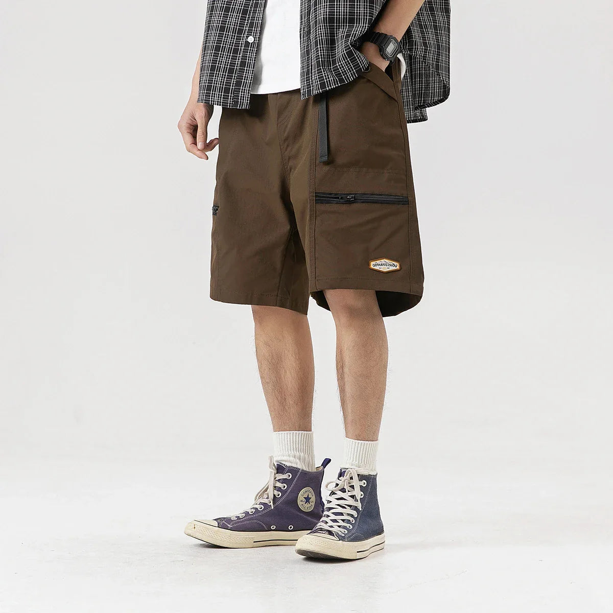 Mountain Vintage Workwear Shorts in black, orange, and army green colors, featuring a fifth-length design and convenient pockets for versatile functionality.