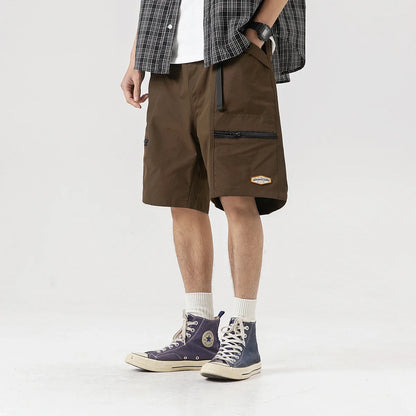 Mountain Vintage Workwear Shorts in black, orange, and army green colors, featuring a fifth-length design and convenient pockets for versatile functionality.