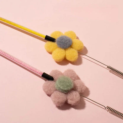 Interactive cat toy with furry ball, feathers, and bell for engaging playtime and exercise