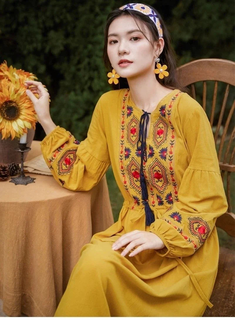 Elegant embroidered cotton-linen dress with tassels, featuring a waist-cinching A-line silhouette in vibrant colors