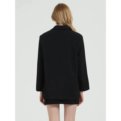 Elegant women's black blazer coat with a turn-down collar, single-breasted closure, and practical pockets for a polished, professional look.