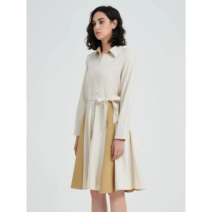 Elegant beige A-line dress with long sleeves, turn-down collar, and included belt for a flattering silhouette