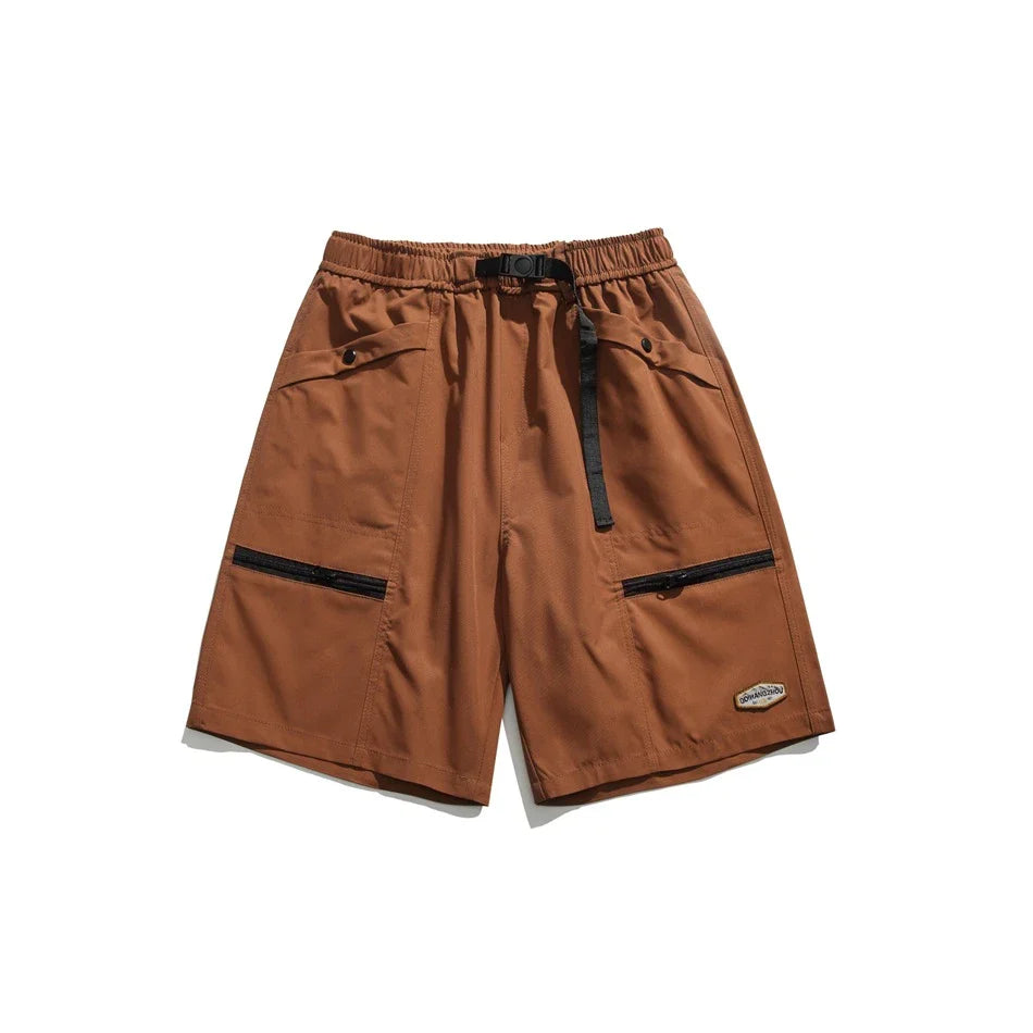 Mountain Vintage Workwear Shorts in black, orange, and army green colors, featuring a fifth-length design and convenient pockets for versatile functionality.