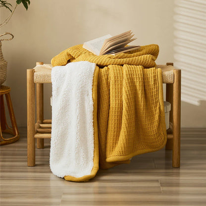 Cozy and stylish cotton plaid throw blanket in classic colors, perfect for adding warmth and charm to any living space