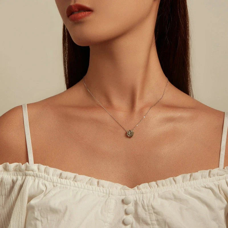 Elegant platinum-plated adjustable green pendant necklace with a sleek, silver-toned chain and a stylish green pendant