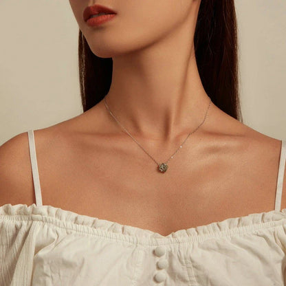 Elegant platinum-plated adjustable green pendant necklace with a sleek, silver-toned chain and a stylish green pendant