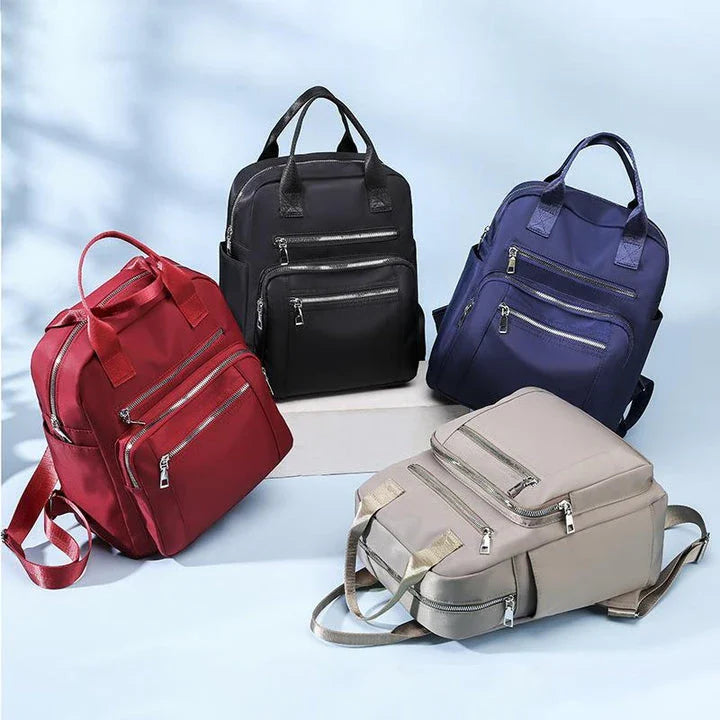 A stylish and durable Oxford cloth backpack with multiple compartments for organized storage and a sleek, portable design.