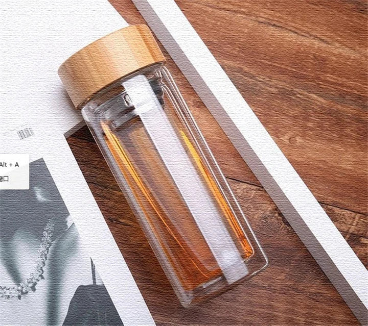 Premium glass water bottle with bamboo infuser lid for healthy, eco-friendly hydration on the go