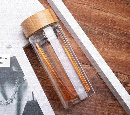 Premium glass water bottle with bamboo infuser lid for healthy, eco-friendly hydration on the go