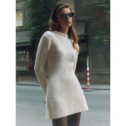 Elegant knitted mini dress with classic O-neck design and long sleeves
