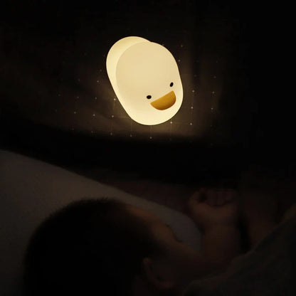 Cute duck-shaped LED night light with silicone and ABS construction, USB charging, and adjustable brightness