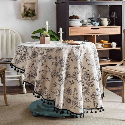 Elegant floral cotton linen round tablecloth with tassels, perfect for dining, kitchen, and home decor