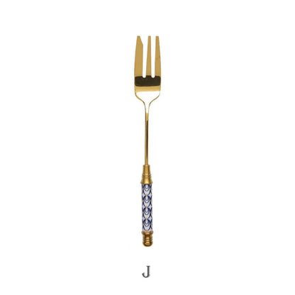 Elegant gold-plated dessert fork with intricate ceramic handle design