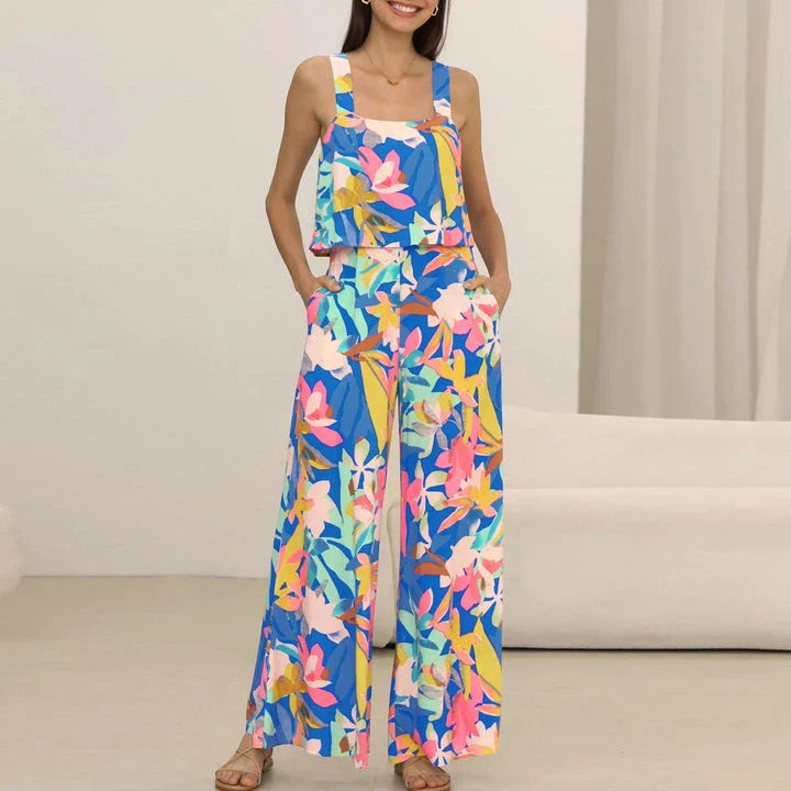 A stylish wide-leg jumpsuit with a paisley print design and a suspender top, perfect for women's casual and streetwear fashion.