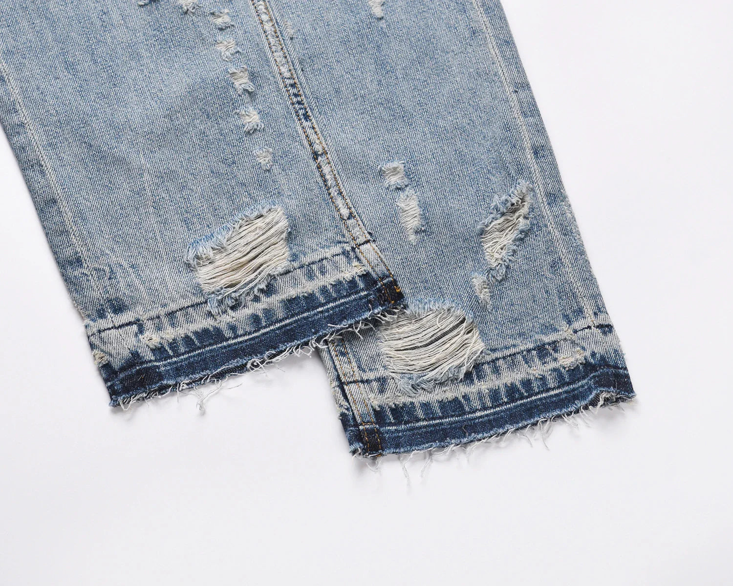 Premium distressed denim jeans with ripped detailing, perfect for casual streetwear style