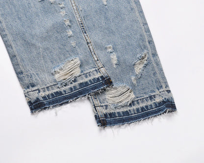 Premium distressed denim jeans with ripped detailing, perfect for casual streetwear style