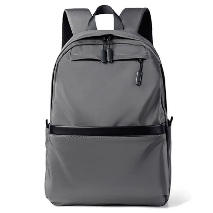 A large, simple, and stylish backpack made of durable nylon material with multiple compartments for organized storage and comfortable shoulder straps for easy carry.