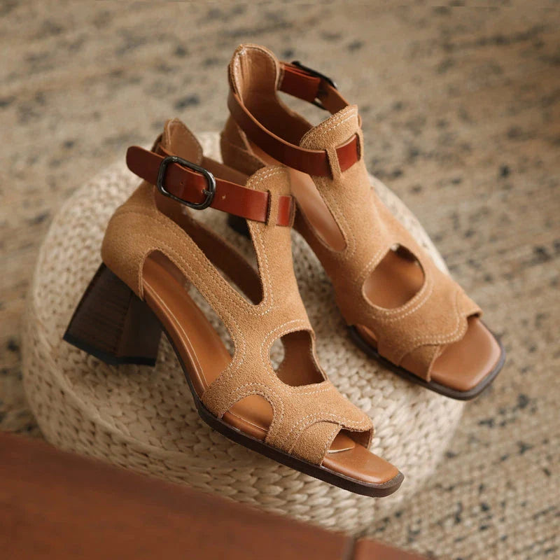 Elegant leather gladiator sandals with adjustable buckle closure and square high heel for stylish summer occasions