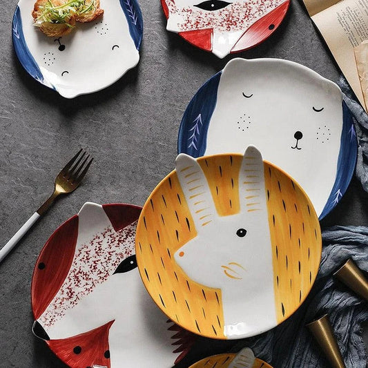 Charming ceramic plate with whimsical animal patterns, available in small and large sizes, perfect for serving meals and snacks.